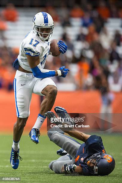 Issac Blakeney of the Duke Blue Devils runs past Julian Whigham of the Syracuse Orange after catching what would be a touchdown reception on November...