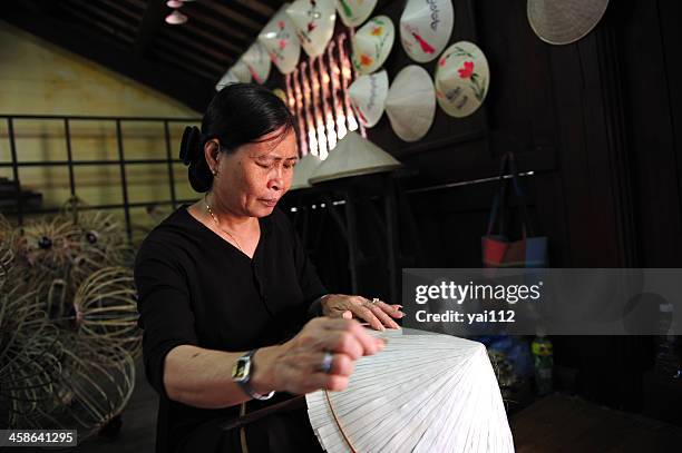 vietnamese straw hat - straw hat stock pictures, royalty-free photos & images