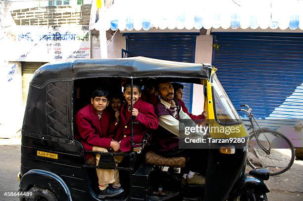 boys on the way home by taking auto rickshaw - auto rickshaw stock pictures, royalty-free photos & images