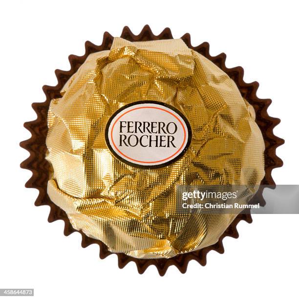 ferrero rocher praline isolated on white background - ferrero rocher chocolate stock pictures, royalty-free photos & images