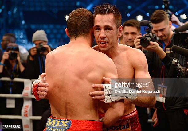 Felix Sturm of Germany and Robert Stieglitz of Germany after their super middleweight elimination fight on November 8, 2014 in Stuttgart, Germany.