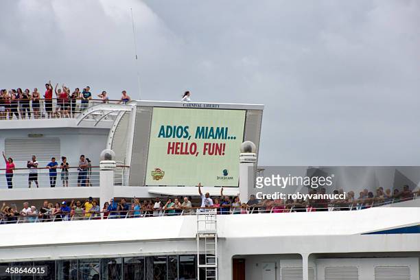 adios miami, hello fun! cruise leaving the harbor - carnival cruise stock pictures, royalty-free photos & images