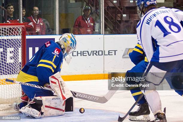 FIlip Gustavsson of Sweden defends the net on a shot from Janne Kuokkamen of Finland during the bronze medal game at the World Under-17 Hockey...