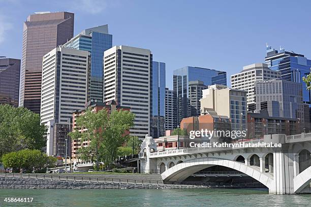 downtown calgary, centre street and bow river, alberta in spring - calgary bridge stock pictures, royalty-free photos & images