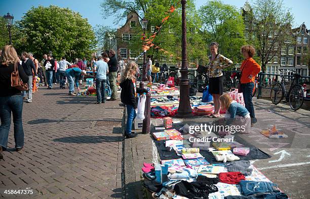 queen's day flea market on the streets of amsterdam - koninginnedag stock pictures, royalty-free photos & images