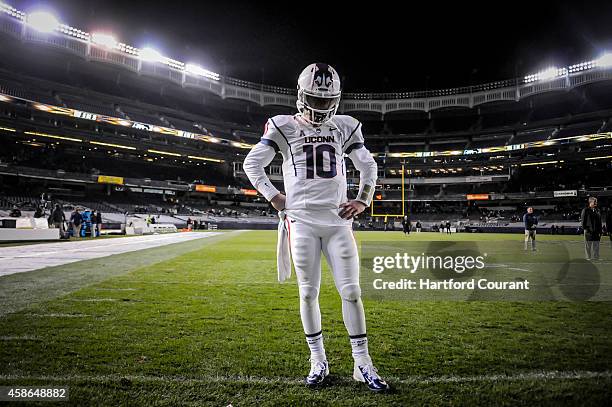 After giving up a 99-yard interception and touchdown to the Army in the final seconds of the game, UConn quarterback Chandler Whitmer stands alone on...