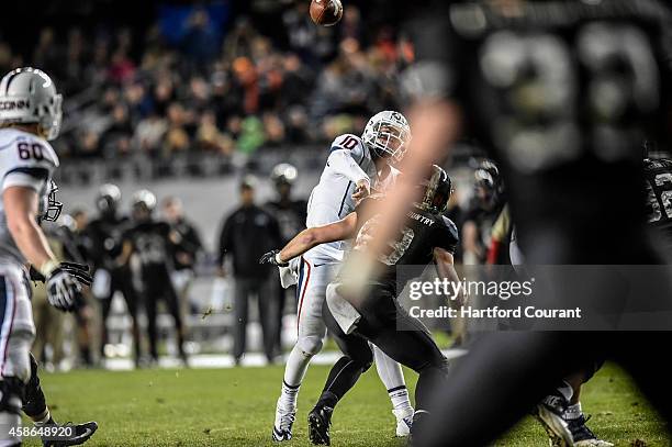 UConn's Chandler Whitmer throws a pass intended for Thomas Lucas inside the final minute of the game on Saturday, Nov. 8 at Yankee Stadium in Bronx,...