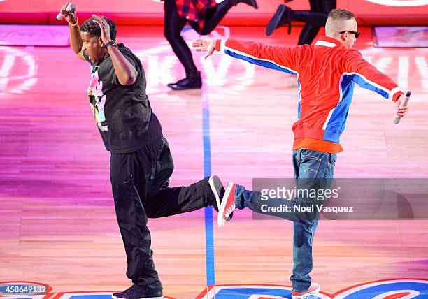 Christopher "Play" Martin and Christopher "Kid" Reid of Kid 'n Play perform during halftime at a basketball game between the Portland Trail Blazers...