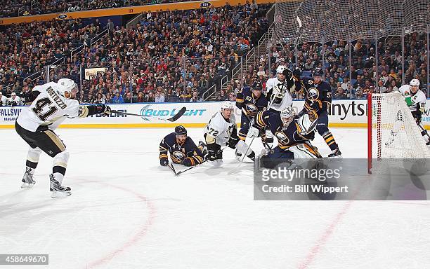 Robert Bortuzzo of the Pittsburgh Penguins scores a second period goal against Jhonas Enroth of the Buffalo Sabres on November 8, 2014 at the First...