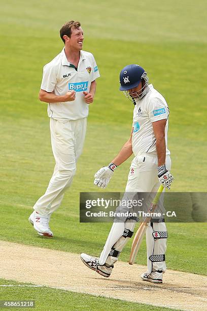 Andrew Fekete of Tasmania celebrates after claiming the wicket of Clint McKay of Victoria during day two of the Sheffield Shield match between...