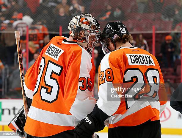 Steve Mason and Claude Giroux of the Philadelphia Flyers celebrate the win over the Colorado Avalanche on November 8, 2014 at the Wells Fargo Center...