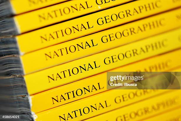 stack of national geographic magazines macro close-up - national geographic society stock pictures, royalty-free photos & images