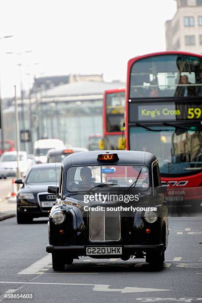 black cab on waterloo bridge london - london taxi stock pictures, royalty-free photos & images