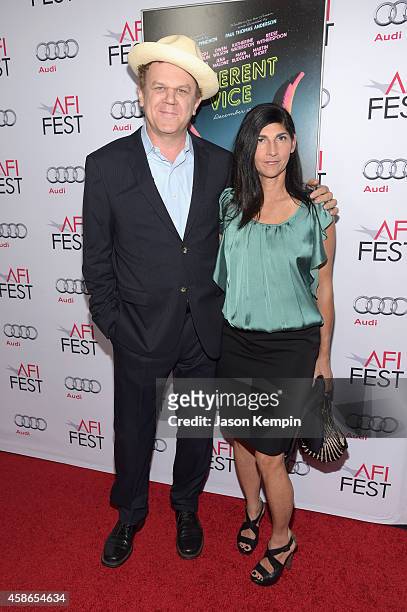 Actor John C. Reilly and Actress Alison Dickey attend the screening of "Inherent Vice" during AFI FEST 2014 presented by Audi at the Egyptian Theatre...