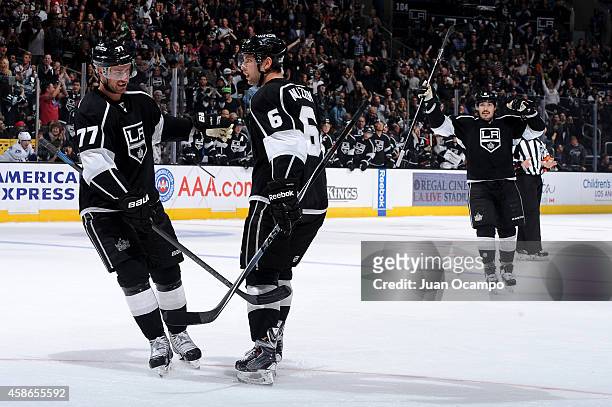 Jeff Carter, Jake Muzzin and Drew Doughty of the Los Angeles Kings celebrate a goal during a game against the Vancouver Canucks at STAPLES Center on...
