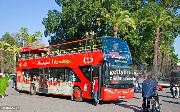 marrakech red sightseeing tourist bus - open top bus stock pictures, royalty-free photos & images