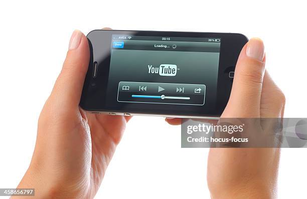 watching youtube video with iphone 4 - watching youtube stock pictures, royalty-free photos & images