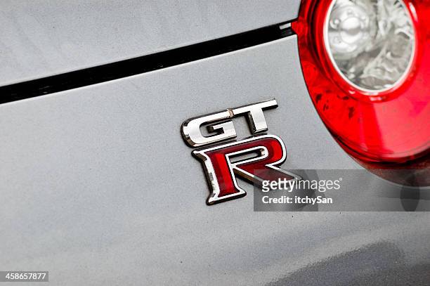 nissan gt-r r35 - silver porsche stock pictures, royalty-free photos & images
