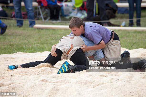 young boys wrestling, lenk, bernese oberland - schwingen stockfoto's en -beelden