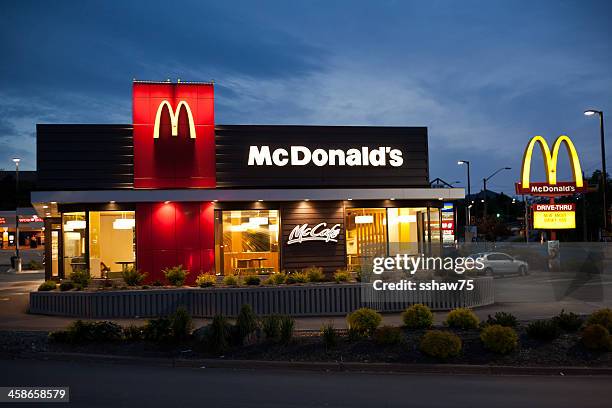 mcdonald's restaurant at dusk - mcdonalds stock pictures, royalty-free photos & images