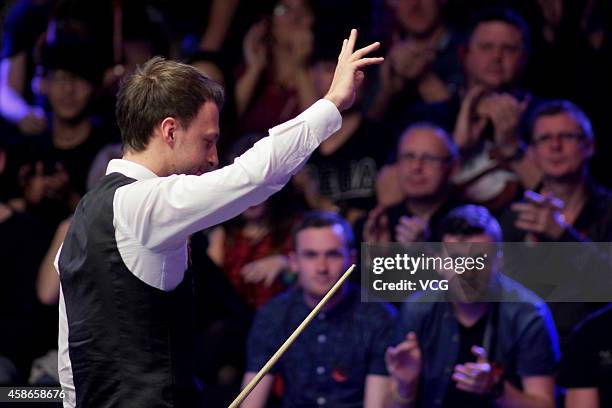 Judd Trump of England reacts against Neil Robertson of Australia on day five of the 2014 Dafabet Champion of Champions at The Ricoh Arena on November...