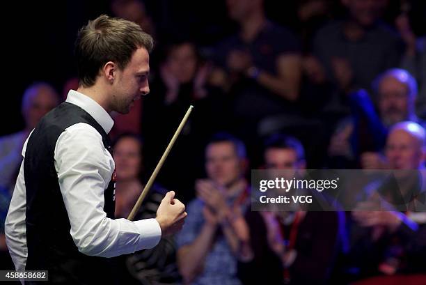 Judd Trump of England reacts against Neil Robertson of Australia on day five of the 2014 Dafabet Champion of Champions at The Ricoh Arena on November...