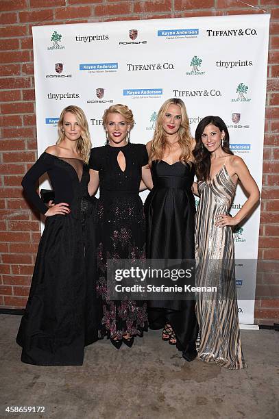 Co-President of Baby2Baby Kelly Sawyer actress Busy Phiillips, actress Molly Sims and co-president of Baby2Baby Norah Weinstein attend the 2014...