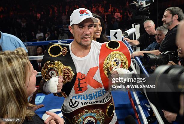 Sergey Kovalev of Russia celebrates defeating Bernard Hopkins of the US fights during their IBF, WBA and WBO light heavyweight title bout at the...