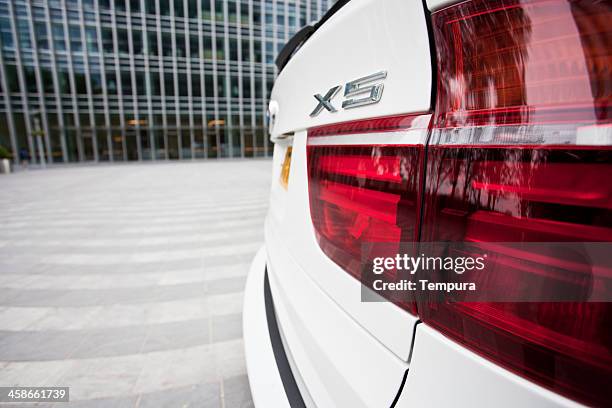rear light view of bmw luxury car. - car blinker stock pictures, royalty-free photos & images