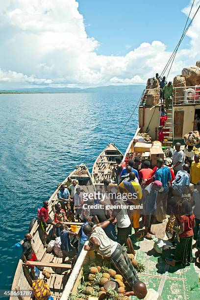 african people are loading goods on board of mv liemba - tanganyikasjön bildbanksfoton och bilder