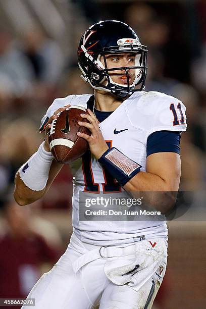 Quarterback Greyson Lambert of the Virginia Cavaliers on a pass play during the game against the Florida State Seminoles at Doak Campbell Stadium on...