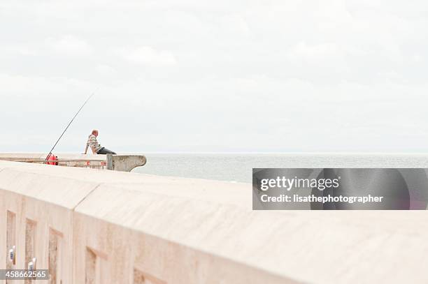 fishing in blackpool - surf casting stock pictures, royalty-free photos & images