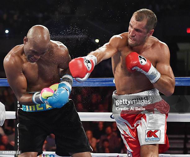 Sergey Kovalev punches Bernard Hopkins during their IBF, WBA, & WBO Light Heavyweight title fight at Boardwalk Hall Arena on November 8, 2014 in...