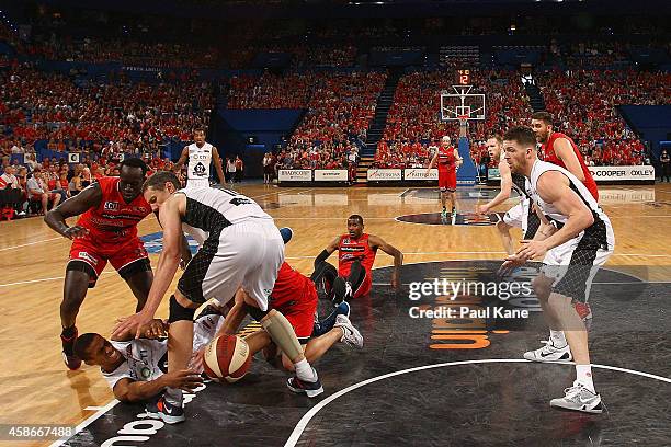 Stephen Dennis of United passes the ball off the floor during the round five NBL match between the Perth Wildcats and the Melbourne United at Perth...