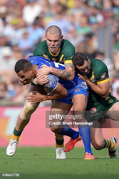 Kyle Stanley of Samoa is tackled during the Four Nations match between the Australian Kangaroos and Samoa at WIN Stadium on November 9, 2014 in...