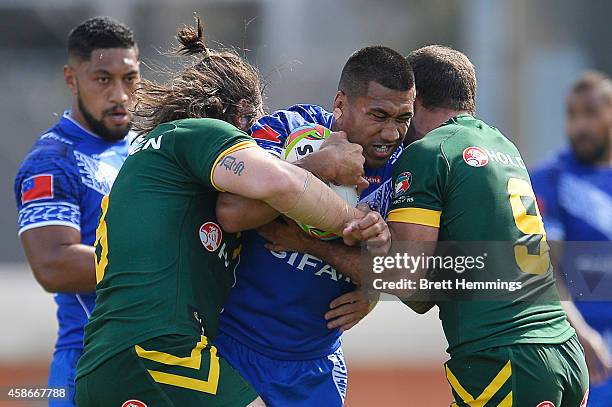 David Fa'alogo of Samoa is tackled during the Four Nations match between the Australian Kangaroos and Samoa at WIN Stadium on November 9, 2014 in...