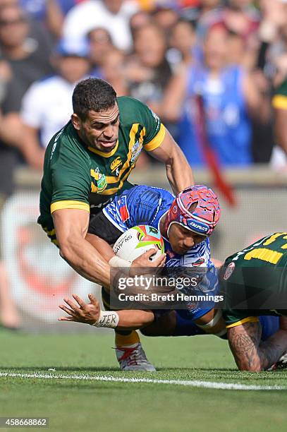 Pita Godinet of Samoa is held up by Greg Inglis of Australia to be denied a try during the Four Nations match between the Australian Kangaroos and...