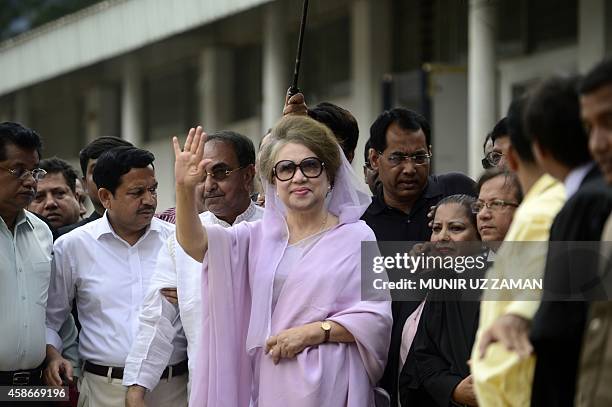 Former Bangladeshi prime minister and Bangladesh Nationalist Party leader, Khaleda Zia waves as she arrives for a court appearance in Dhaka on...