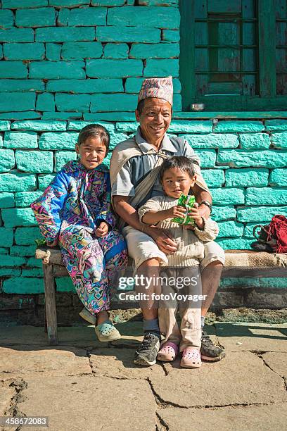 smiling family in annapurna village himalayas nepal - nepal family stock pictures, royalty-free photos & images