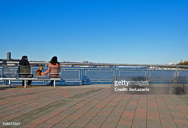 looking at the hudson river view, west side, manhattan, nyc - riverside park manhattan stock pictures, royalty-free photos & images