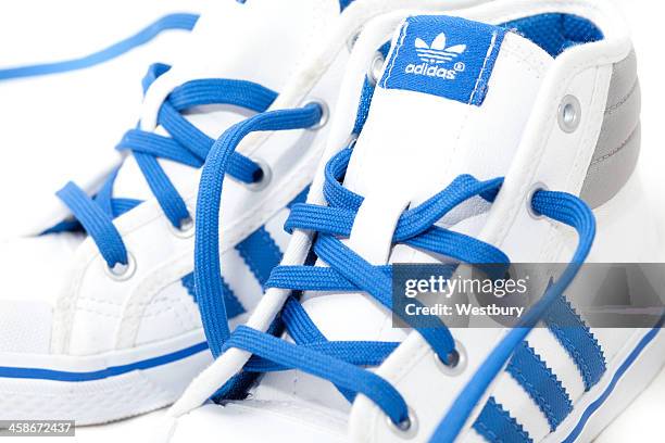 adidas trainers isolated - adidas shoes stock pictures, royalty-free photos & images