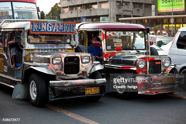 manila, philippines - jeepney traffic - philippines jeepney stock pictures, royalty-free photos & images