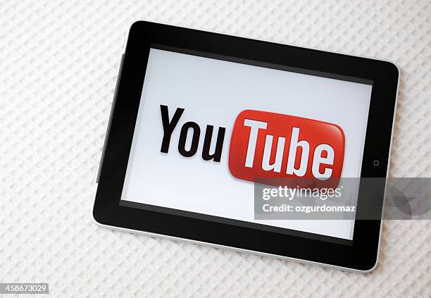 youtube logo on ipad screen - youtube stock pictures, royalty-free photos & images