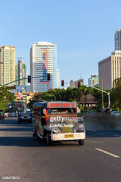 colourful jeepney vehicle in metro manila philippines - philippines jeepney stock pictures, royalty-free photos & images