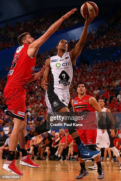 Stephen Dennis of United drives to the basket against Tom Jervis of the Wildcats during the round five NBL match between the Perth Wildcats and the...