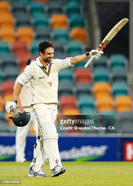 Ed Cowan of Tasmania celebrates scoring a century during day two of the Sheffield Shield match between Tasmania and Victoria at Blundstone Arena on...