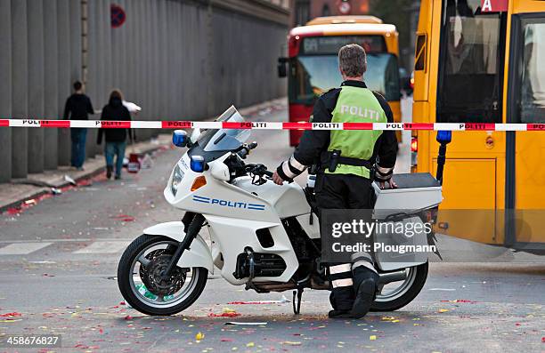 motorcycle cop controlling traffic - roped off stockfoto's en -beelden