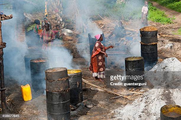 workers in a palm oil production, burundi - palm oil production stock pictures, royalty-free photos & images