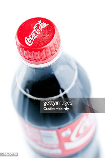 coca-cola plastic bottle isolated on white background - cola bottle stock pictures, royalty-free photos & images