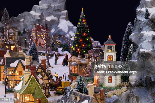 decorative christmas village with charles dickens theme - dickens stockfoto's en -beelden